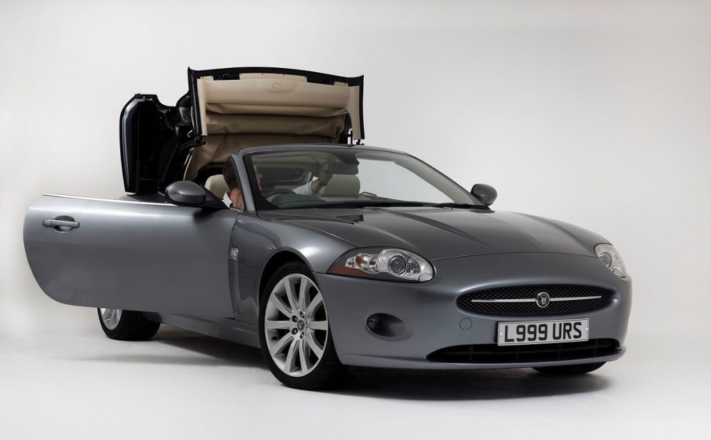A Jaguar XK Convertible shows off its sport car drop-top styling, which still leaves enough space for golf clubs.