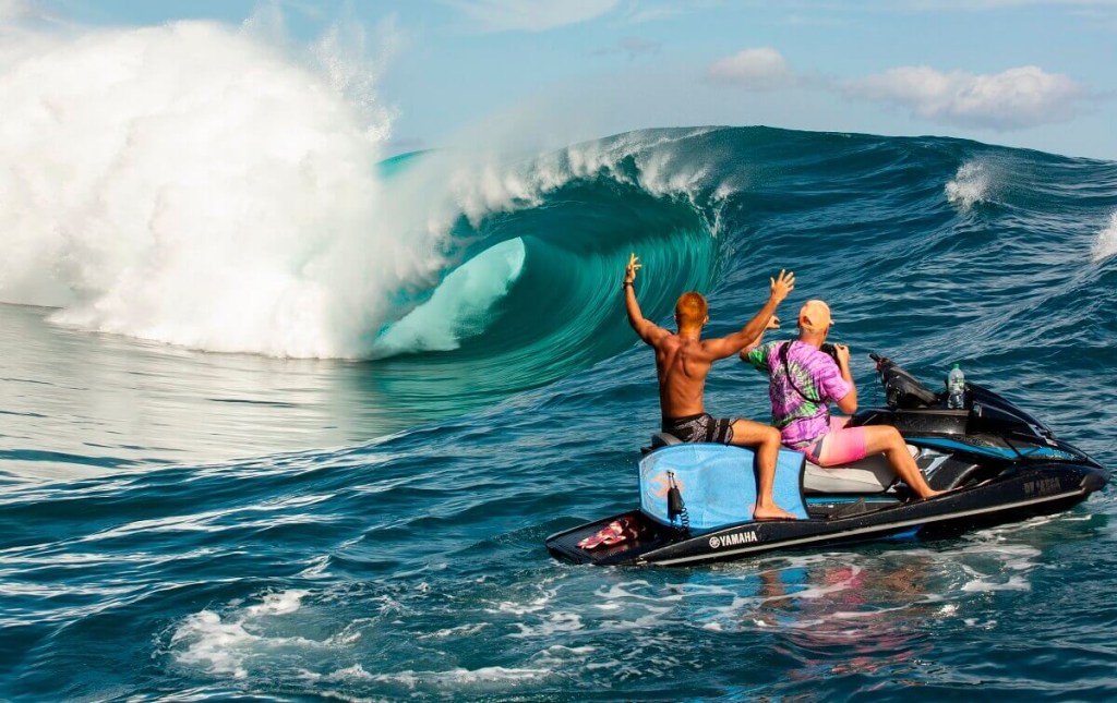 A set of riders show how long a jet ski can last in rough waters as they watch the waves. 