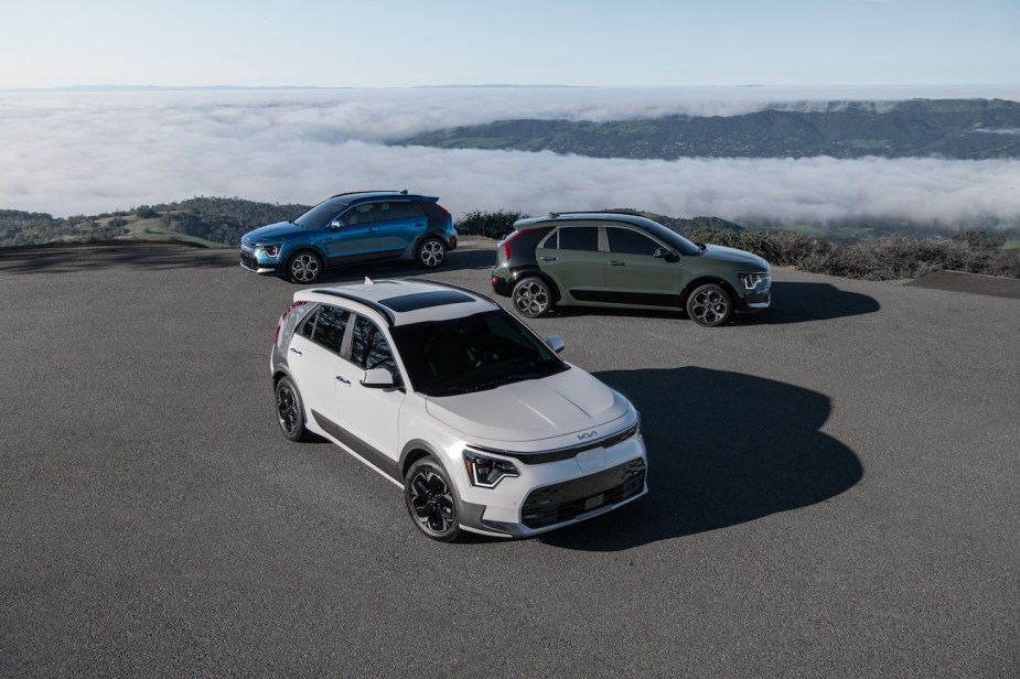A lineup of three different 2023 Kia Niro models parked. Kia Niro sales are starting to increase.