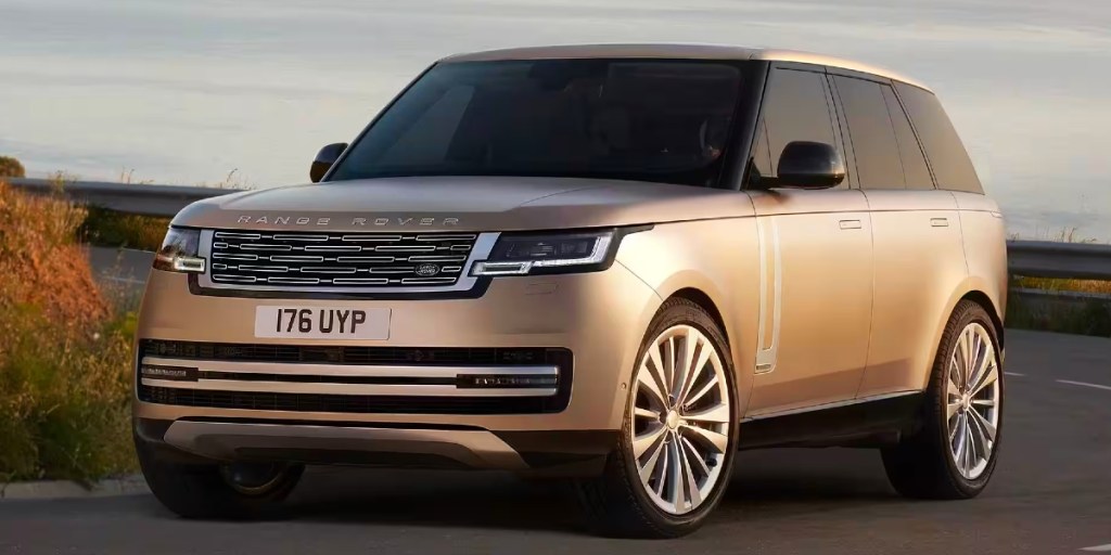 A gray 2023 Land Rover Range Rover is parked on the road.