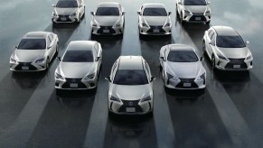 An overhead shot army of white Lexus NX SUVs against a cloudy backdrop. Lexus SUV sales are percolating lately