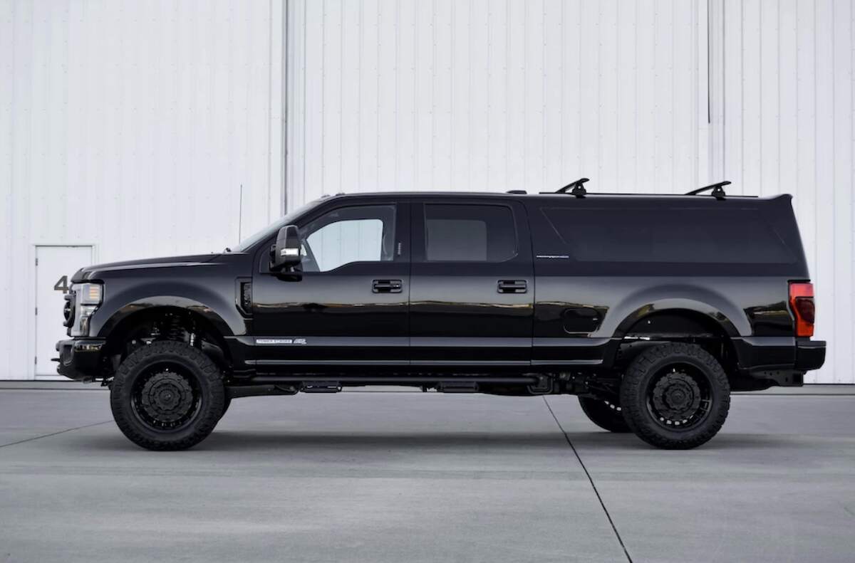 Driver's side view of a black Ford F-250 'Excursion' conversion by MegaRexx Trucks