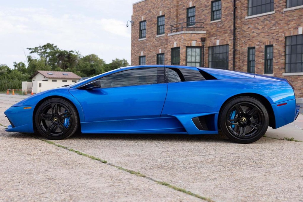 Side profile view of an extremely rare 2007 manual Lamborghini Murcielago in Monterey Blue that now holds the Cars and Bids record