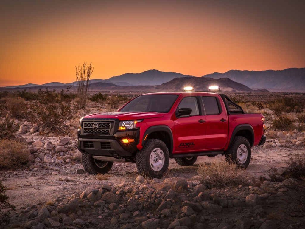 The Nissan Frontier Hardbody Concept parked in the sand at dusk 