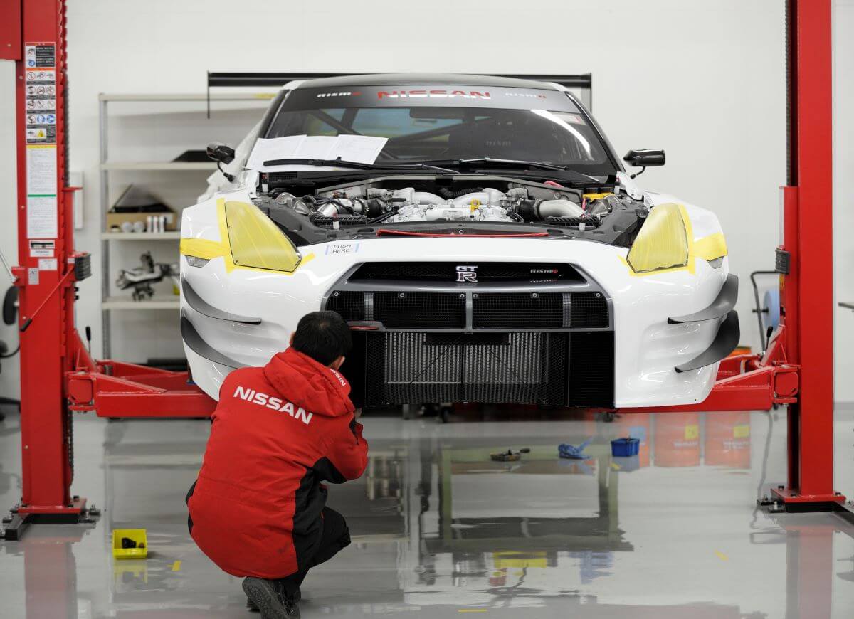 A Nissan GT-R performance sports car inside a repair shop at Nismo global headquarters in Yokohama City, Japan