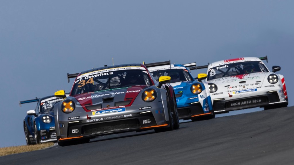 A series of Porsche 911 GT3 Cup cars, like the Nissan GT-R groups in 'Gran Turismo,' take to the track.