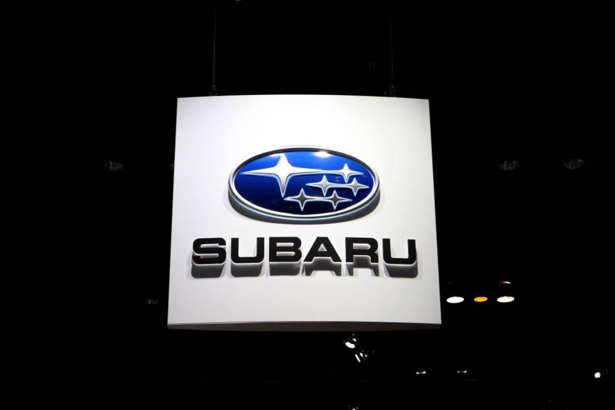 A Subaru on display at an auto show.