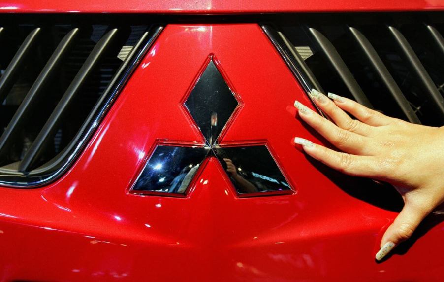 A Thai model posing with the new Mitsubishi Triton pickup truck model at its launching ceremony in Bangkok