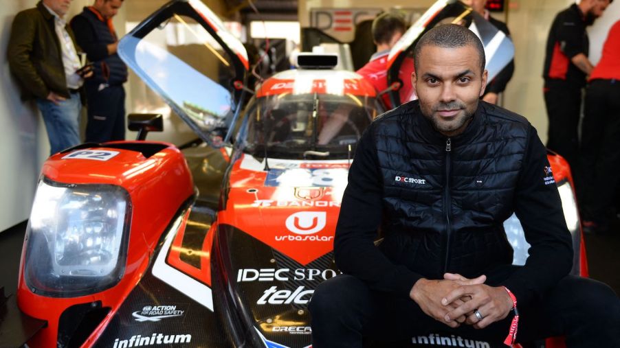 Former San Antonio Spurs basketball player Tony Parker poses in front of an Oreca 07 Gibson LMP2 car. Tony Parker's car collection is extensive.