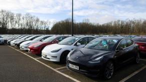 A lot of used Tesla electric cars with plummeting resale value.