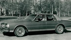A black and white photo from the 1980s of a Chevy Caprice full-size B-body sedan model