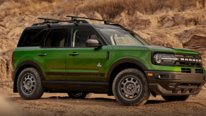A 2024 Ford Bronco Sport with the Black Diamond Off-Road Package compact SUV model parked on dirt and sand