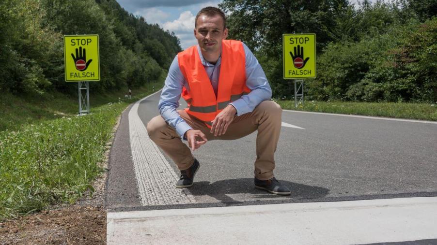 Inventor of one-sided rumble strips, Konstantin Berkovych, showing their implementation on German roads
