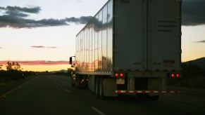 18-wheeler semi-truck driving down the highway.