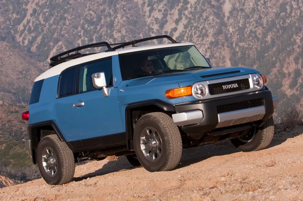2006 Toyota FJ Cruiser SUV off-road with mountains behind it