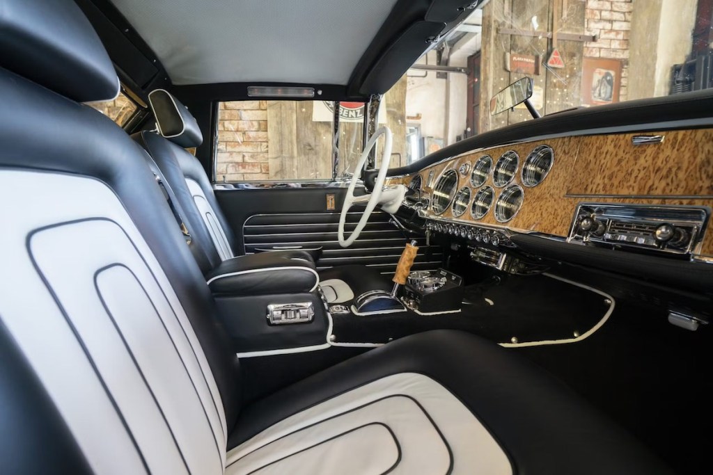 Luxury interior of the Gaylord Gladiator 1957 supercar prototype, with white leather and a tropical wood dashboard.