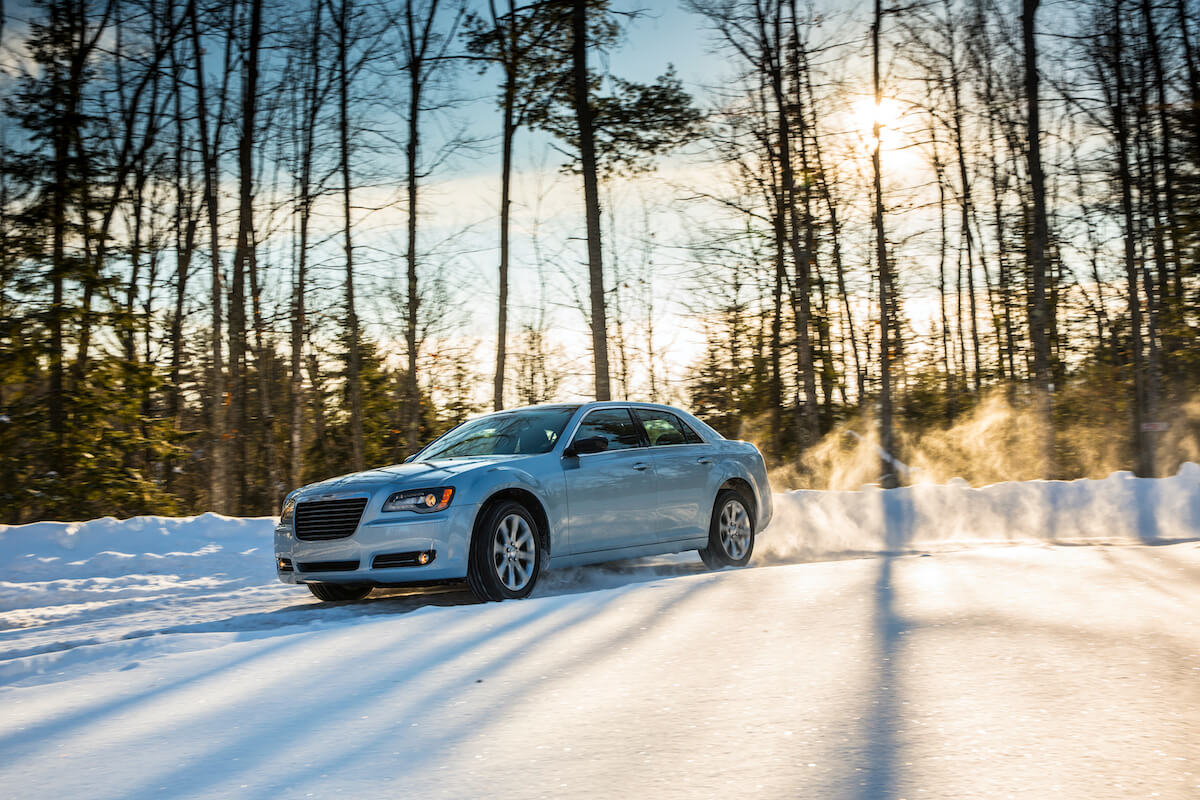 A 2013 Chrysler 300 drives through the snow