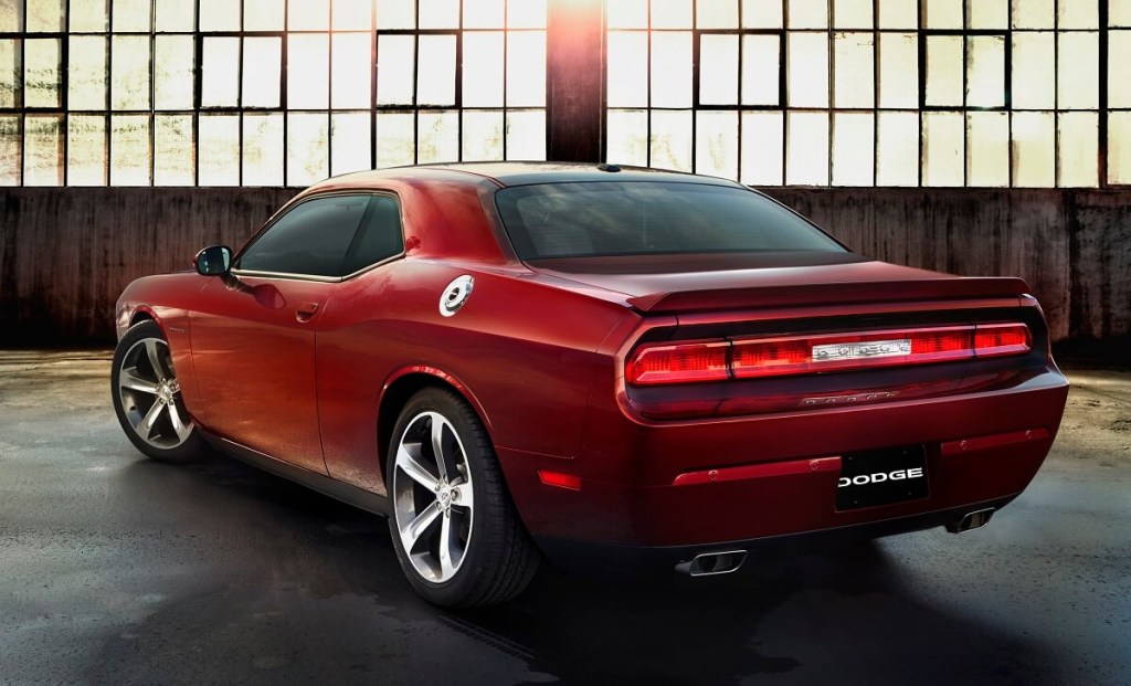 A dark-red 2014 Dodge Challenger R/T shows off its single-piece taillight assembly. 