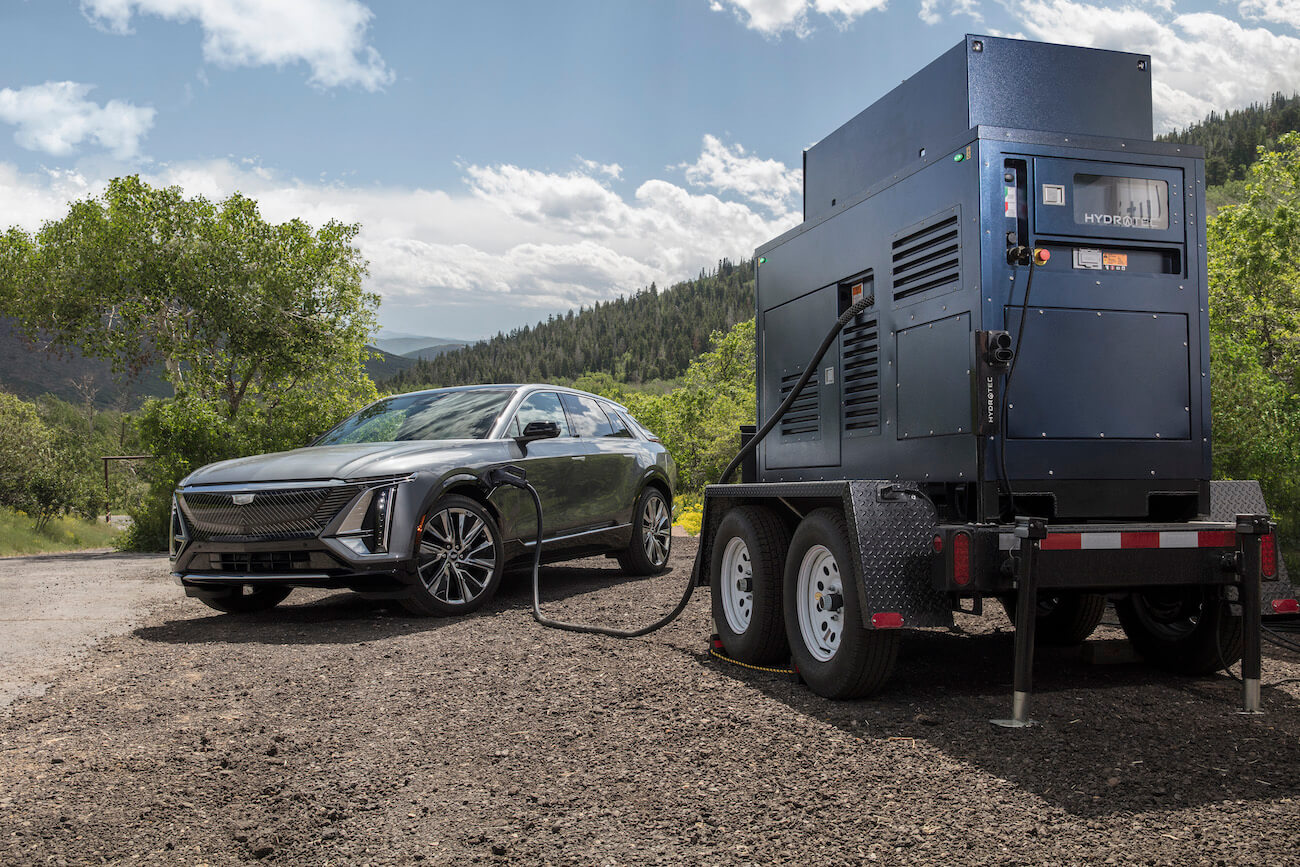 A gray 2023 Cadillac Lyriq charging with a mobile generator. While not necessarily a top contender, the Cadillac Lyriq value shouldn't be underestimated.