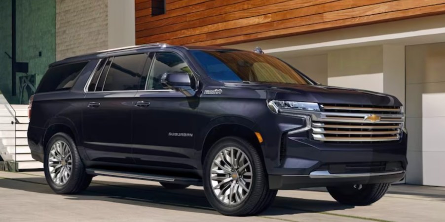 A black 2023 Chevrolet Suburban full-size SUV is parked.