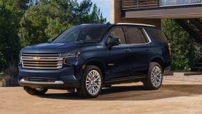 A blue 2023 Chevrolet Tahoe full-size SUV is parked outdoors.
