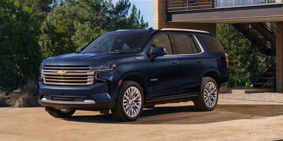 A blue 2023 Chevrolet Tahoe full-size SUV is parked outdoors.