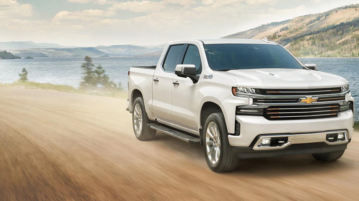 The 2023 Chevy Silverado driving on a dirt road