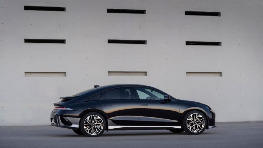 A black 2023 Hyundai EV, the IONIQ 6, shows off its slippery shape, which establishes it as one of the most efficient electric cars.