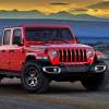 2023 Jeep Gladiator Texas Trail parked in a desert in front of mountains