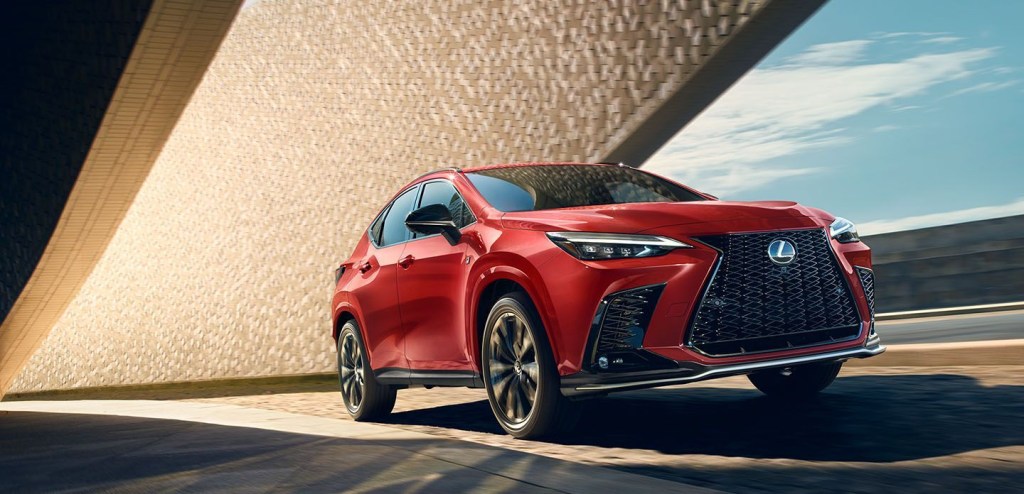 A red 2023 Lexus NX 350 on the road