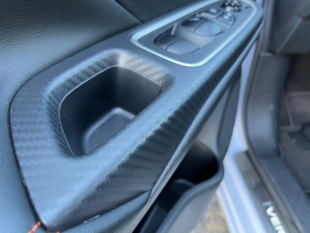 A shot of the door panel in the 2023 Nissan Versa SR