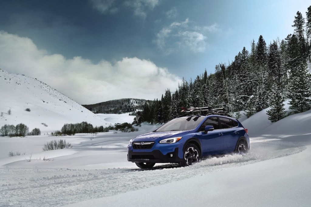 A 2023 Subaru Crosstrek driving in the snow