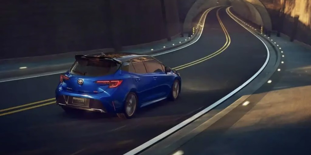 The 2023 Toyota Corolla Hatchback driving down the road