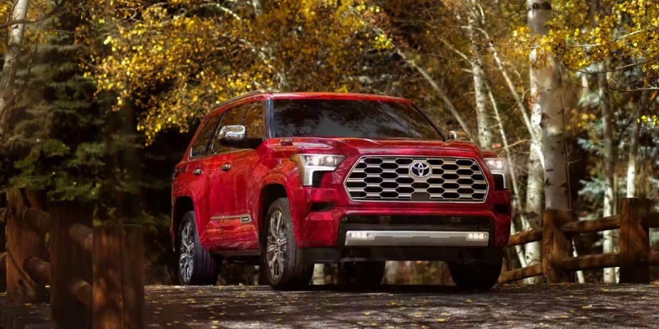 A red 2023 Toyota Sequoia full-size SUV is parked outdoors. 