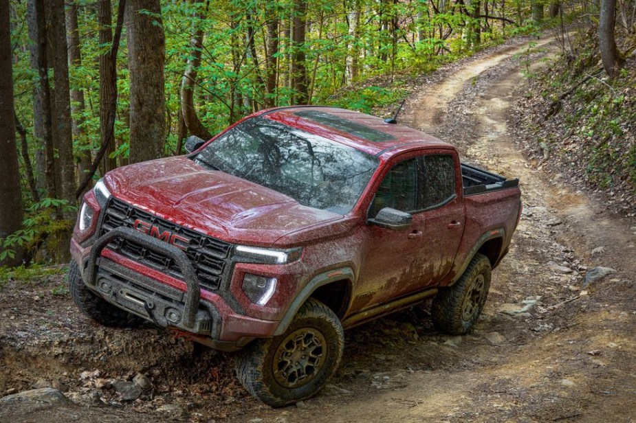 The 2023 GMC Canyon AT4X off-roading through mud 