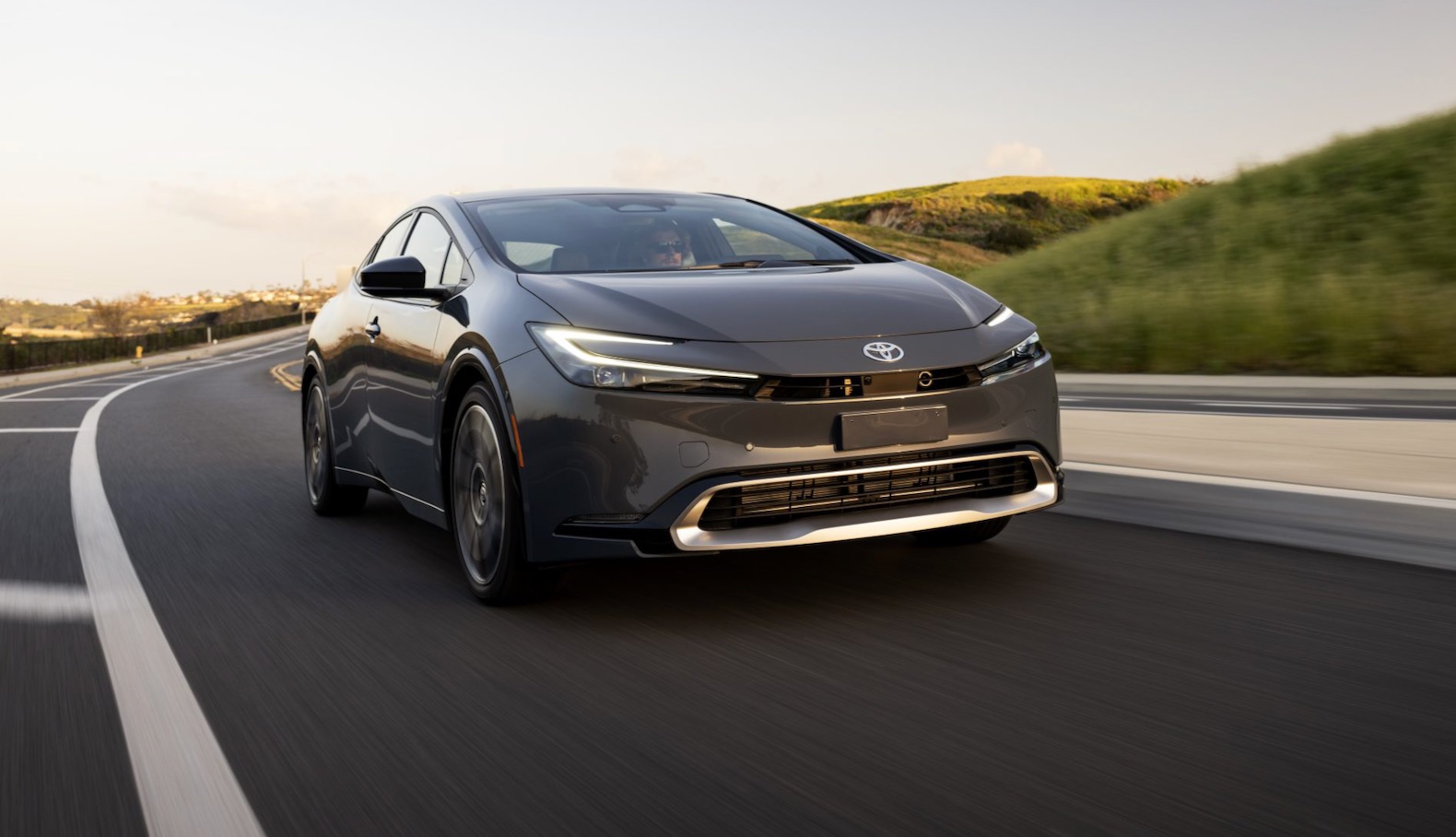 The 2023 Toyota Prius driving on the road 