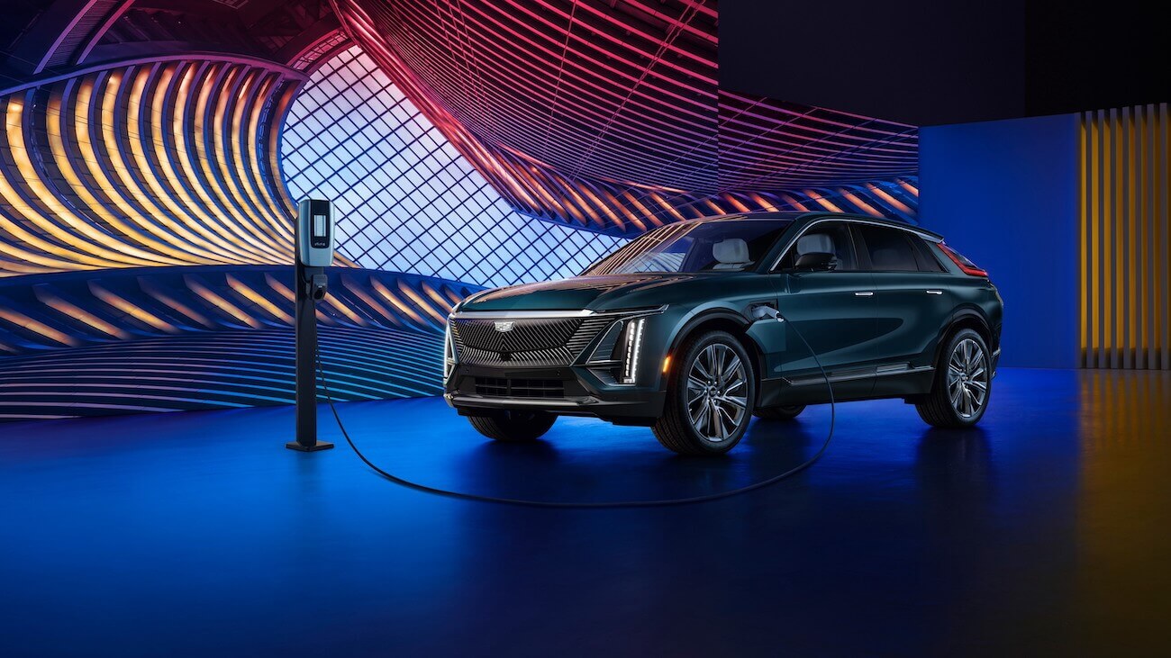 A blue 2024 Cadillac Lyriq charging on display. The 2024 Cadillac Lyriq price can fluctuate depending on what features you want.
