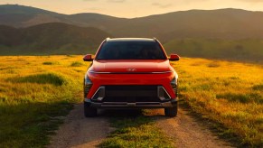 A 2024 Hyundai Kona subcompact SUV is parked in a field.