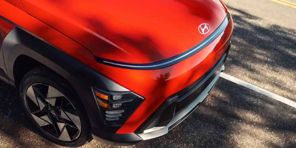 The front of an orange 2024 Hyundai Kona subcompact SUV.