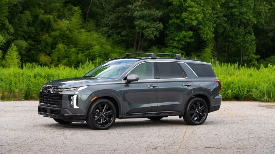 A gray 2024 Hyundai Palisade XRT parked in front of the woods. Hyundai Palisade sales are on the decline.
