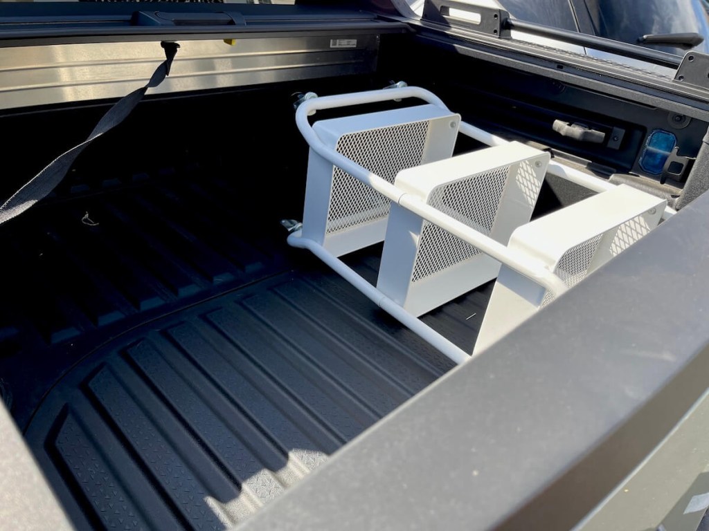 The cargo area in the 2024 Hyundai Santa Cruz XRT with a cart in it