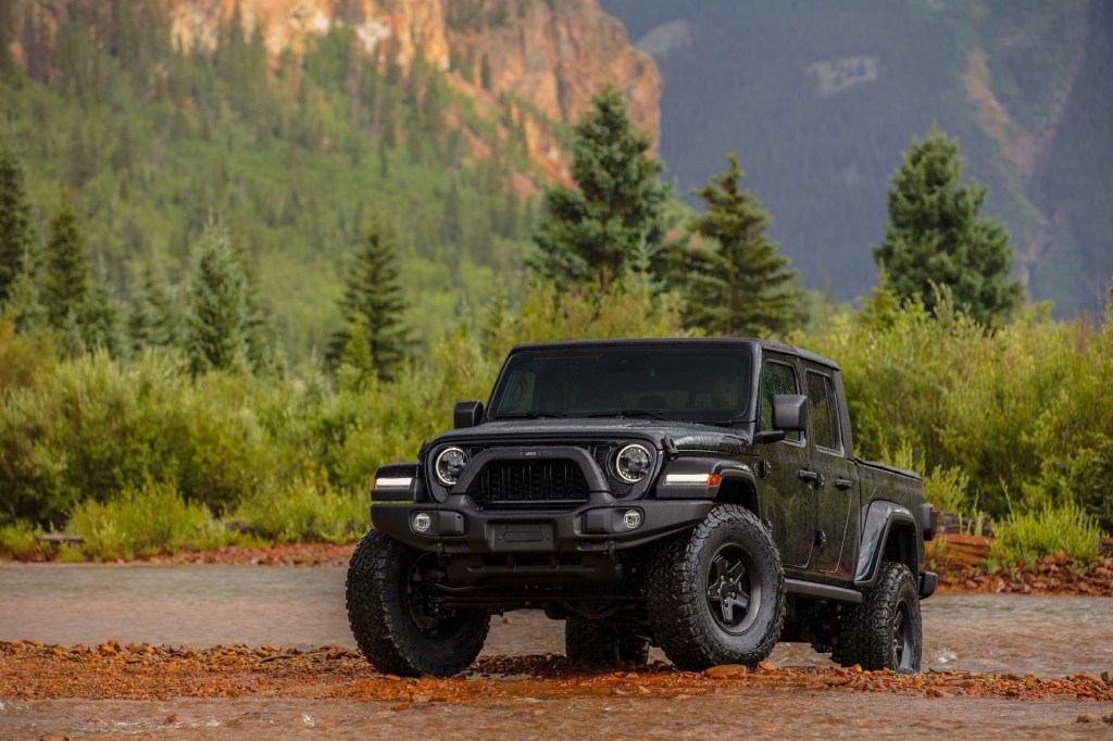 The 2024 Jeep Gladiator off-roading in mud 