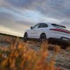 A white 2024 Porsche Cayenne parked on a plain field. The Cayenne recall affects 3,000 2024 models.