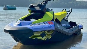 A two-seater Sea-Doo SPARK TRIXX shows off its bright blue and yellow livery.