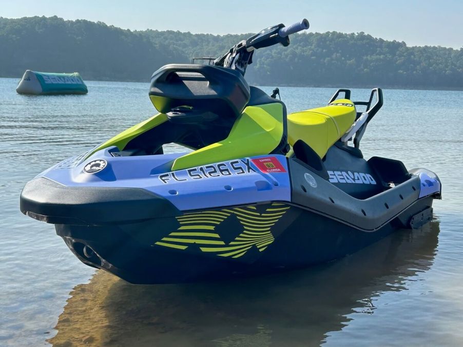 A two-seater Sea-Doo SPARK TRIXX shows off its bright blue and yellow livery.