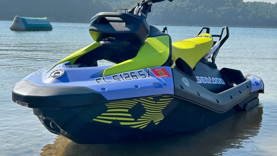 A two-seater Sea-Doo SPARK TRIXX shows off its bright blue and yellow livery.