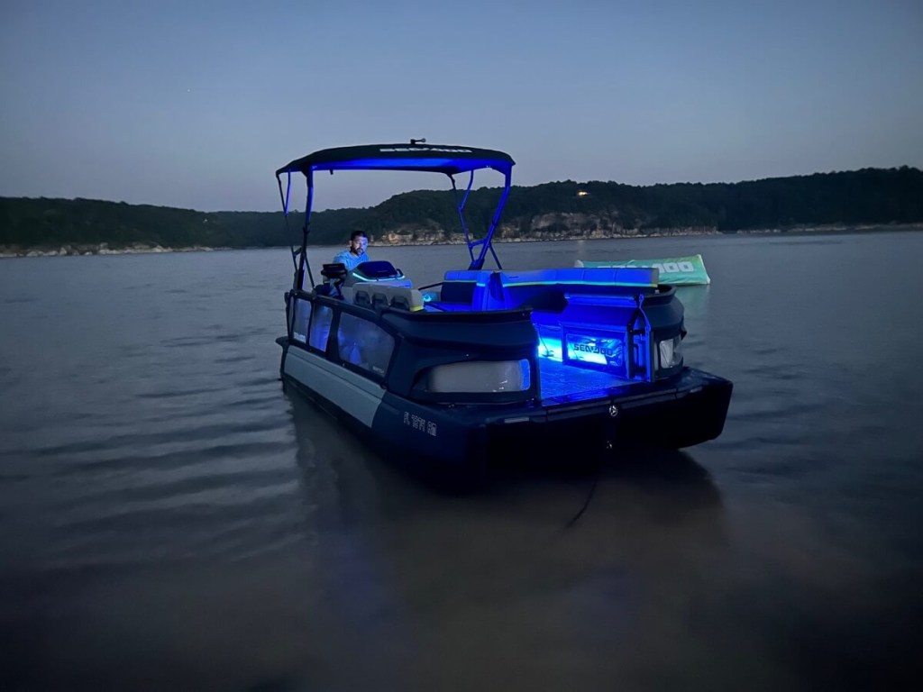 A 2024 Sea-Doo Switch Cruise Limited shows off its blue lights, a feature included in the base price. 