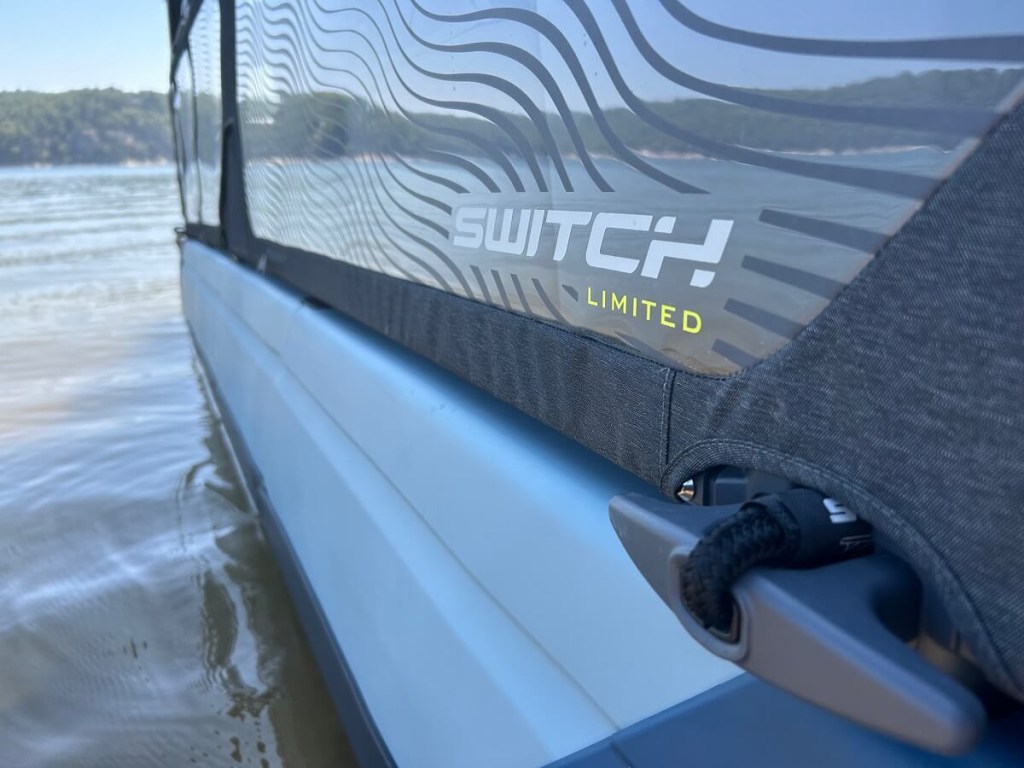 A Sea-Doo pontoon boat shows off its siding with a Limited logo.