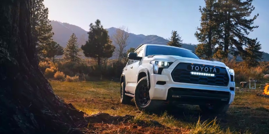 A white 2024 Toyota Sequoia full-size SUV is reliable and parked outdoors. 