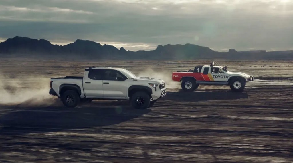 Two Toyota Tacoma trucks racing in the desert 